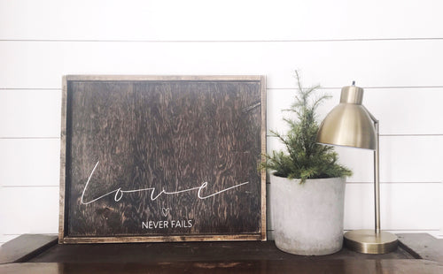 Love Never Fails Wood Sign